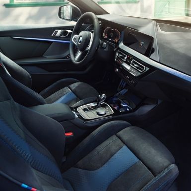 Sporty BMW 1 Series interior. BMW 1 Series cockpit with M Sport seats, M Leather steering wheel and illuminated interior trim finishers.