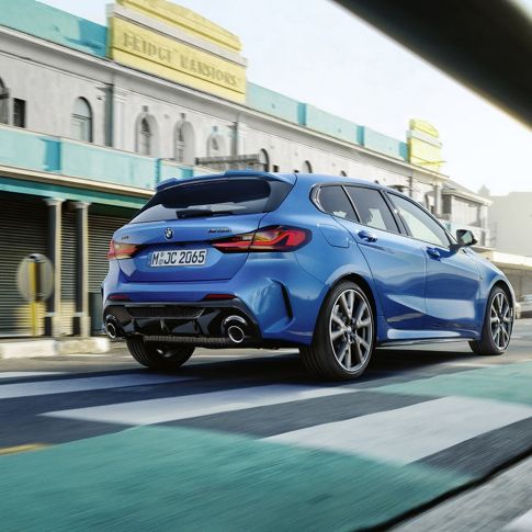 BMW 1 Series rear view. The all-new BMW 1 Series M135i from a rear view, parking in front of a residential building.