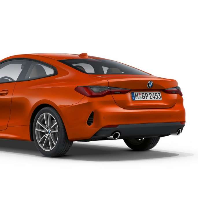 Three-quarter rear view BMW 4 Series Coupé Basic equipment G22 2020 BMW 4 Series Coupé G22 2020 Basic equipment Sunset Orange metallic three-quarter rear view