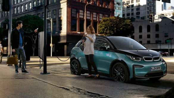 BMW i3 I01 2018 at a public charging station Couple charging their BMW i3 at a public charging station I01 2018 Blue Ridge Mountain with Frozen Grey metallic highlight