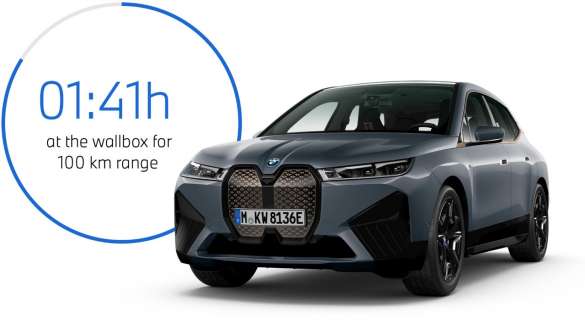 BMW iX M60 i20 2022 electric SUV BMW Individual Storm Bay metallic three-quarter front view with charging time graphic