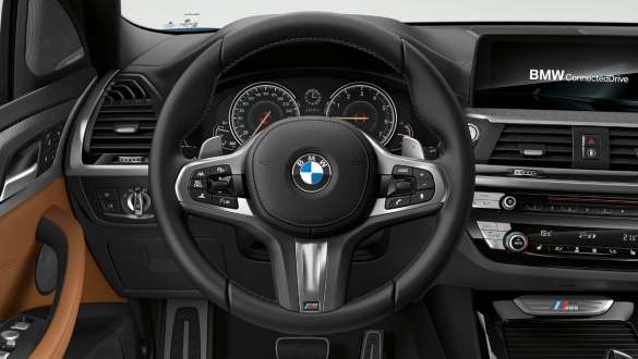 BMW X3 M40i and BMW X3 M40d SUV G01, M leather steering wheel. BMW X3 M40i and BMW X3 M40d SUV G01, interior, cockpit with M leather steering wheel.