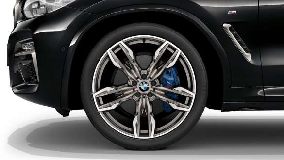BMW X3 M40i and BMW X3 M40d SUV G01, M Sport brakes. BMW X3 M40i and BMW X3 M40d SUV G01 in Black Sapphire metallic, exterior, light alloy wheel with M Sport brake.