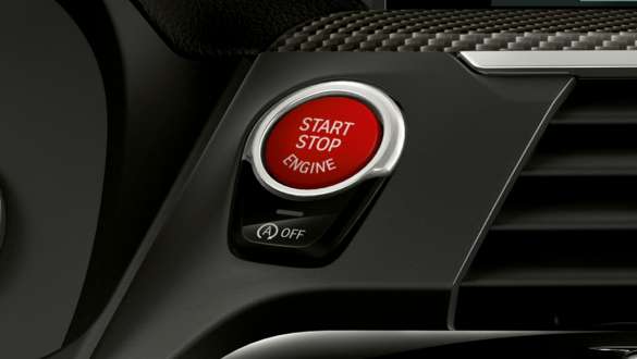 BMW X3 M Competition SUV F97, red Start/Stop button. BMW X3 M Competition SUV F97, interior, cockpit, red Start/Stop button.