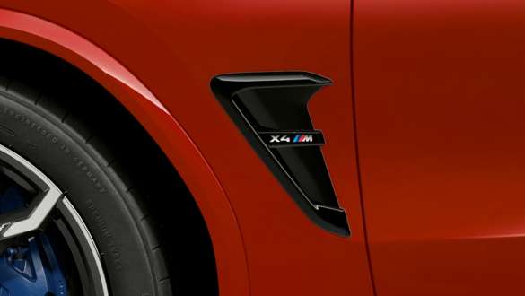 BMW X4 M Competition SUV F98, M gill with model designation. BMW X4 M Competition SUV F98 in Toronto Red metallic, exterior, M gill in Black high-gloss with model designation.