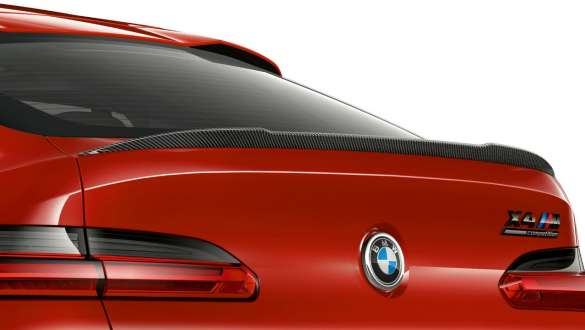 BMW X4 M Competition SUV F98, M rear spoiler in carbon. BMW X4 M Competition SUV F98 in Toronto Red metallic, exterior, M Carbon exterior package, M rear spoiler in carbon.