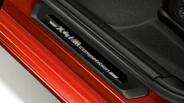 BMW X4 M Competition SUV F98, door sill finishers with Competition designation. BMW X4 M Competition SUV F98, interior, door sill finishers with Competition designation.