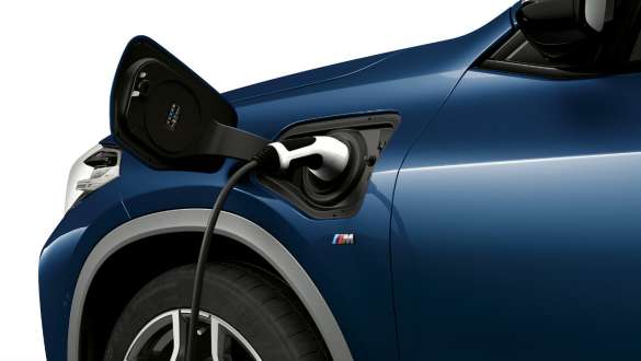 Charging flap closeup side view BMW X2 xDrive25e SUV plug-in hybrid F39 BMW X2 xDrive25e SUV plug-in hybrid F39 2020 side view closeup