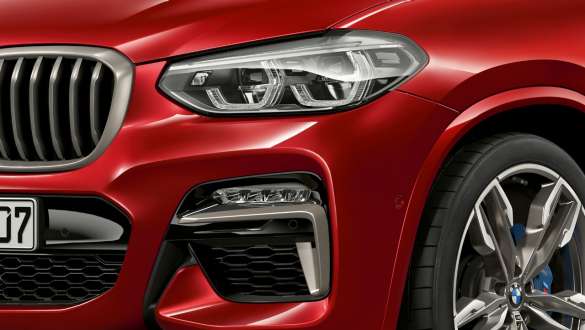 Adaptive LED headlights and air inlets BMW X4 Adaptive LED headlights and air inlets BMW X4 M40i G02 2018 Flamenco Red brilliant effect close-up front