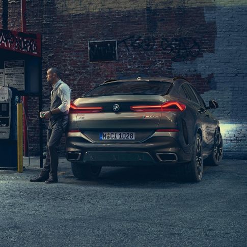 BMW X6 SUV G06 rear. BMW X6 SUV G06 in rear perspective in front of an urban setting.