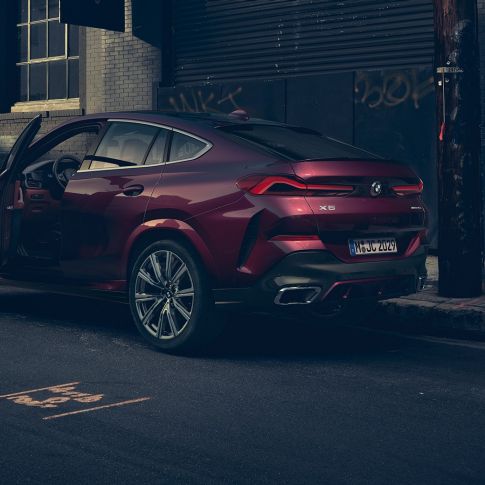 BMW X6 SUV G06 Individual rear view. BMW X6 SUV G06 Individual standing in three-quarter rear.