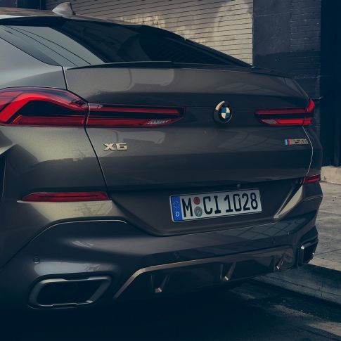 M sport exhaust system oft he BMW X6 SUV G06. Close-up of the M sport exhaust system oft he BMW X6 SUV G06.