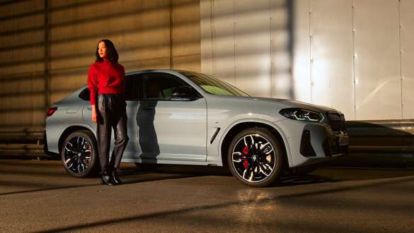 Plug-in hybrid BMW X2 xDrive25e F39 front view in front of garage Plug-in hybrid BMW X2 xDrive25e F39 front view in front of garage with model