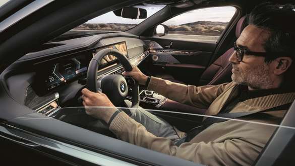 Man in BMW hands on steering wheel Man driving in BMW hands on steering wheel