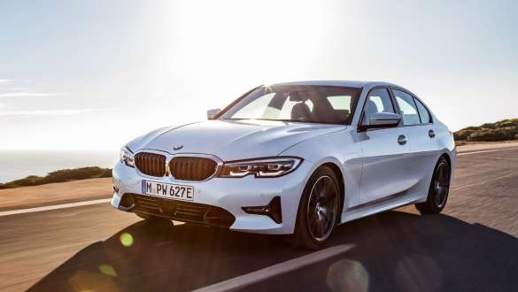 BMW Touring driving front view BMW Touring driving 3/4 front view