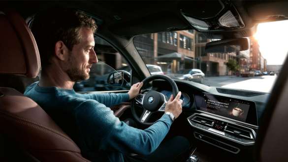Man in BMW driving Man in BMW driving navigation system