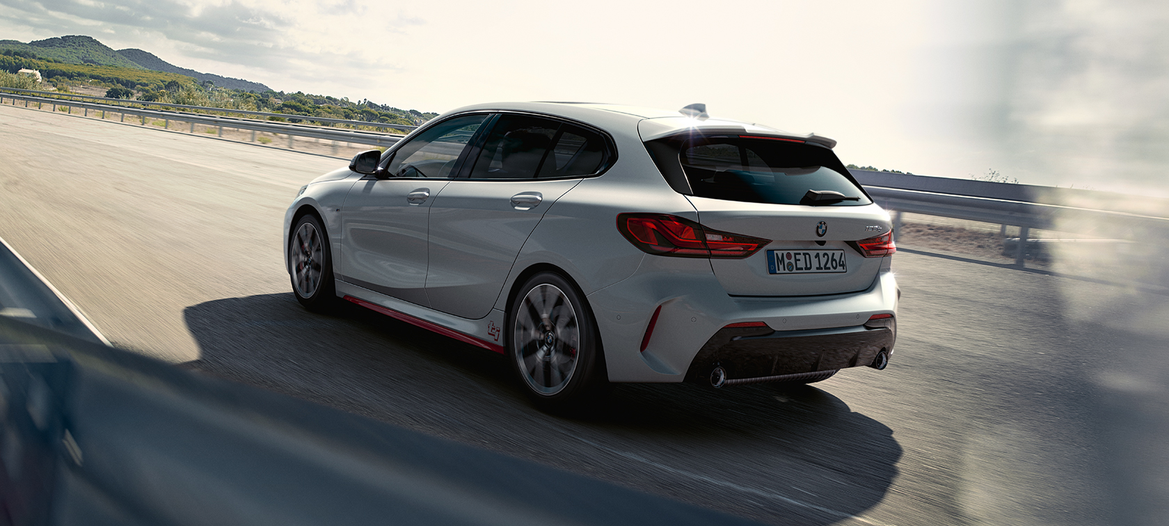 BMW 1 Series 128ti three-quarter rear view BMW 1 Series 128ti F40 three-quarter rear view driving