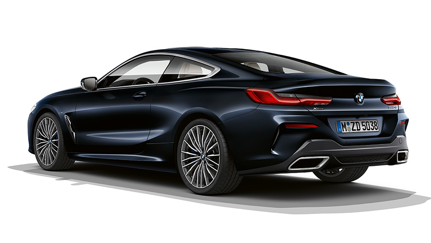 Still shot of the BMW 8 Series Coupé in carbon black metallic against a white background.