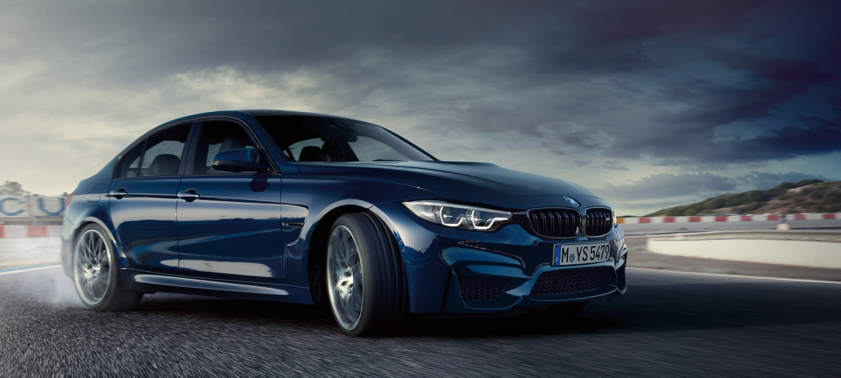 BMW M-Series M3 Sedan in dark blue: speeding car frontside view BMW M-Series M3 Sedan in dark blue: speeding car frontside view