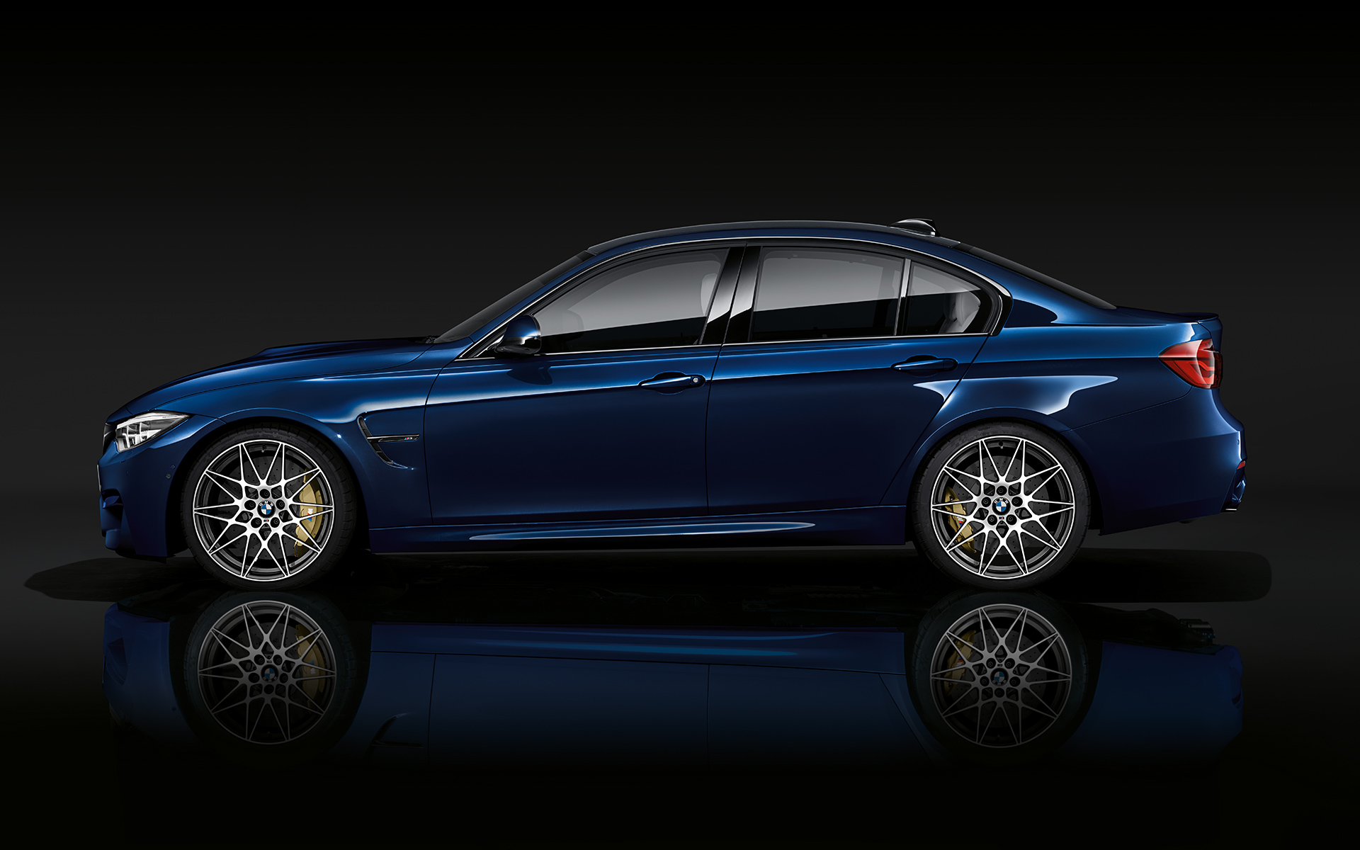 M xDrive. BMW M5 Competition three-quarter front shot while driving.