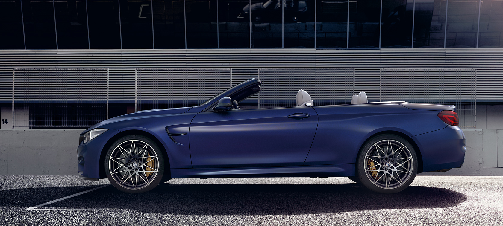BMW M-Series M4 Convertible bright blue side view BMW M-Series M4 Convertible bright blue side view