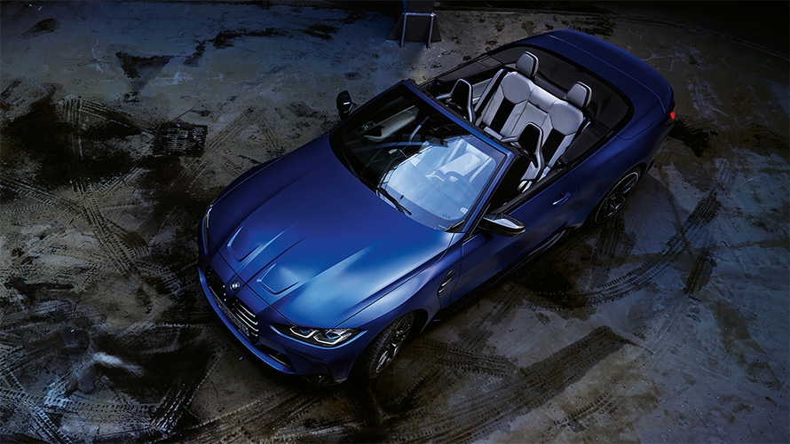 BMW M4 Competition Convertible with M xDrive G83 2021 BMW Individual Frozen Portimao Blue metallic bird’s eye view with open softtop BMW M4 Competition Convertible with M xDrive G83 2021 BMW Individual Frozen Portimao Blue metallic bird’s eye view with open softtop