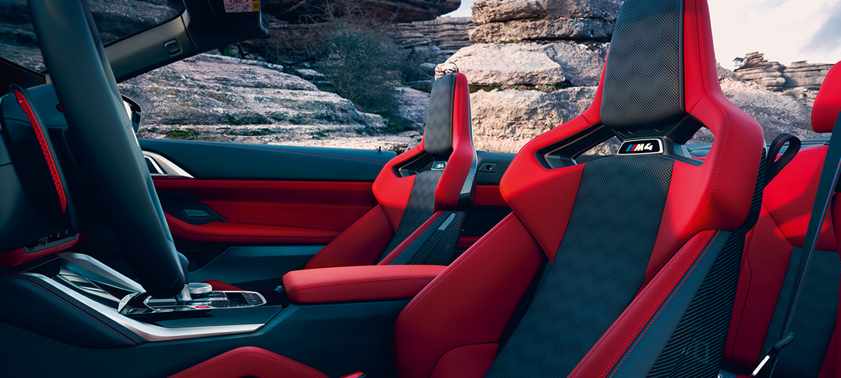 BMW Individual full leather trim 'Merino' Fiona Red/Black BMW M4 Competition Convertible with M xDrive G83 2021 BMW Individual full leather trim 'Merino' Fiona Red/Black BMW M4 Competition Convertible with M xDrive G83 2021 interior side view with open softtop