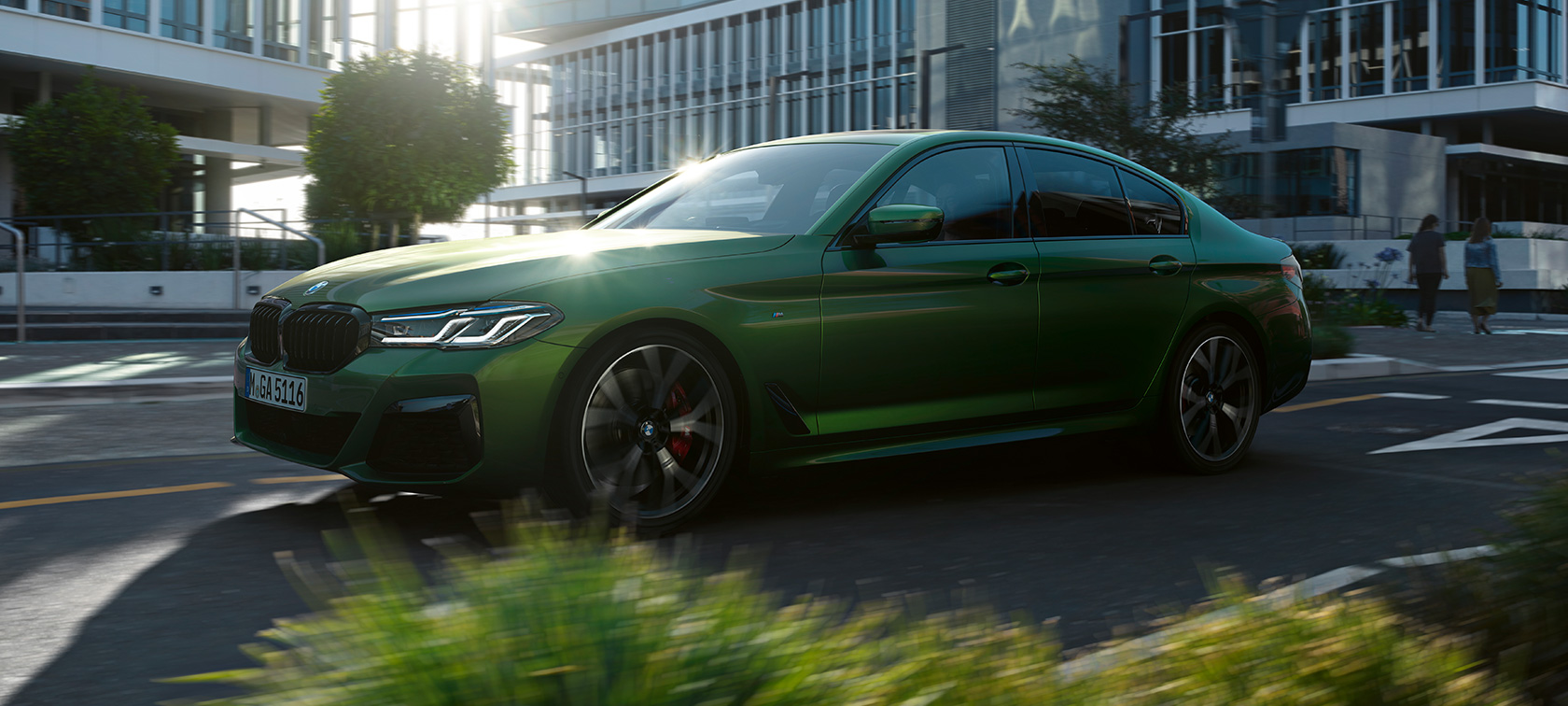BMW M550i xDrive Sedan G30 2020 side view driving BMW M550i xDrive Sedan G30 LCI Facelift 2020 BMW Individual Verde Ermes metallic side view driving