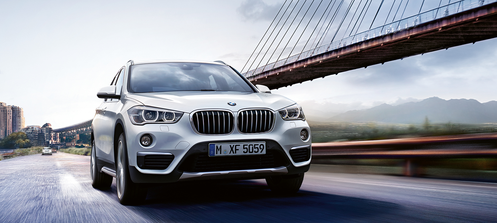 BMW X-Series X1 metallic - bumper view: fast moving car BMW X-Series X1 metallic - bumper view: fast moving car