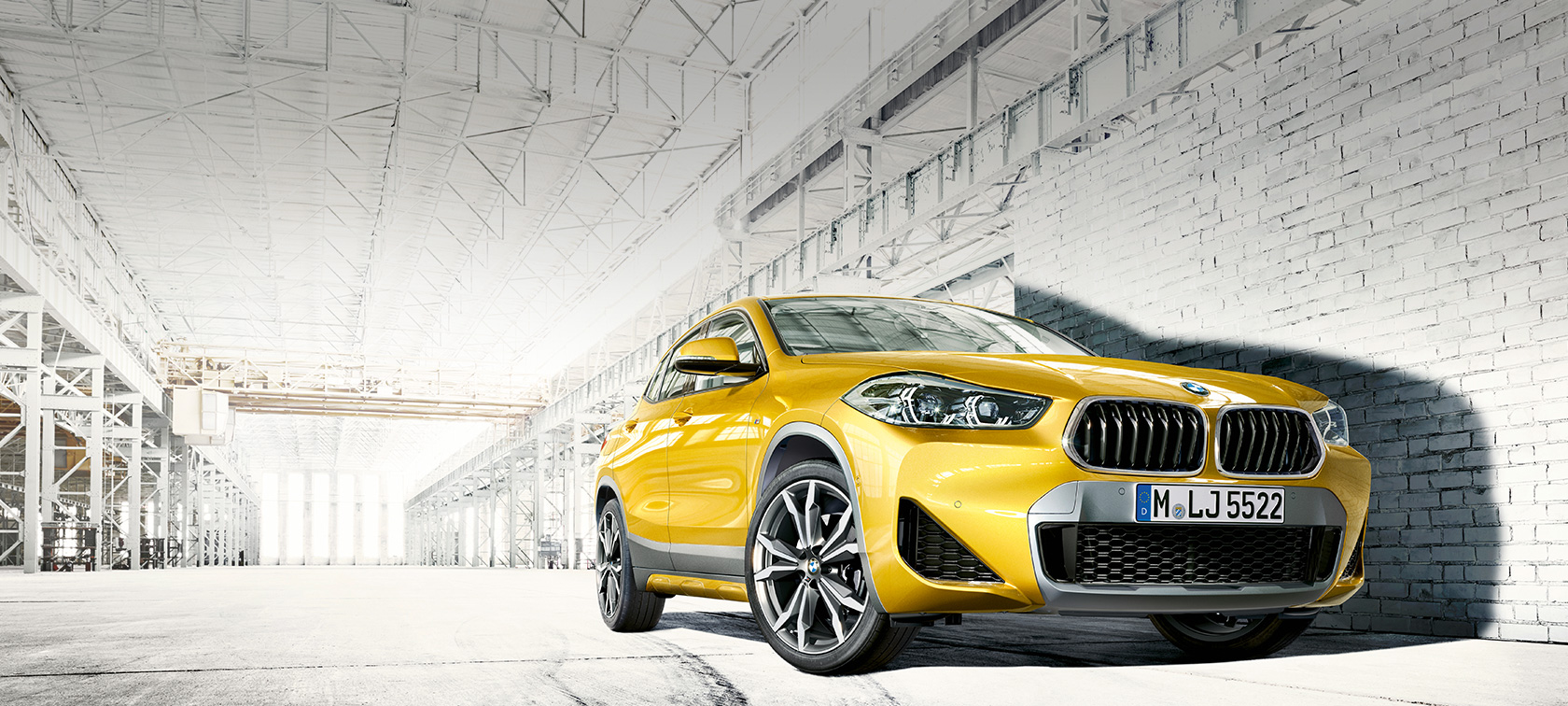 Three-quarter side view driving BMW X2 F39