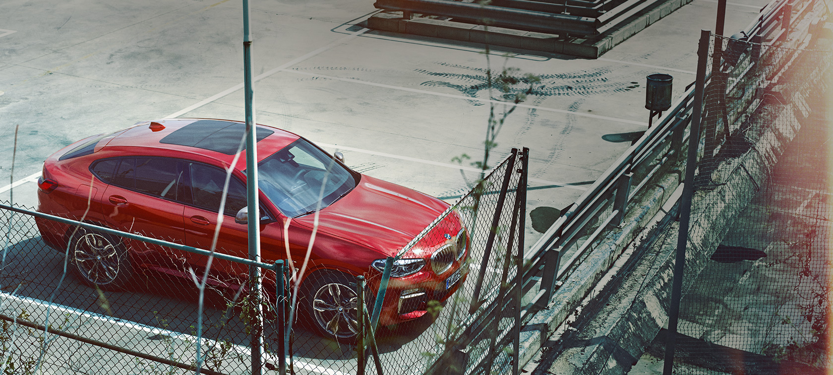 BMW X4 SUV G02 parking BMW X4 SUV G02 2018 Flamenco Red brilliant effect parking on parking deck bird’s eye view