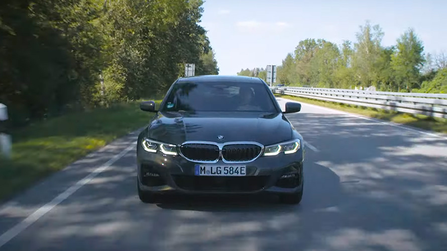 BMW plug-in hybrid driving on the street BMW X5 G05 BMW plug-in hybrid driving on the street front view