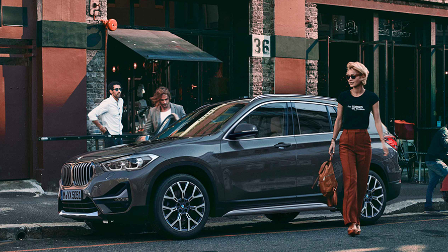 Woman driving a BMW BMW Financial Services BMW Guaranteed Asset Protection woman driving a BMW