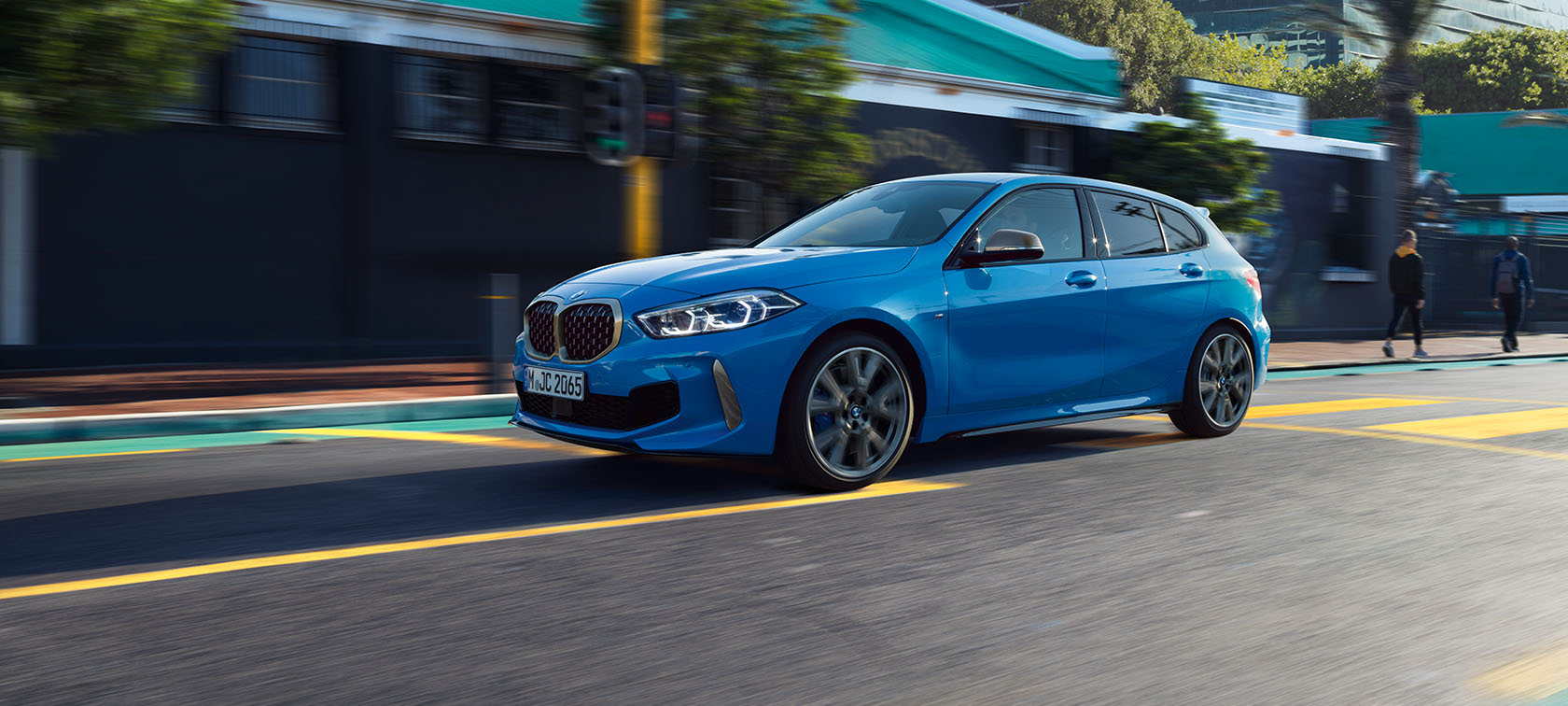 BMW 1 Series F40 in Misano Blue metallic, front view driving