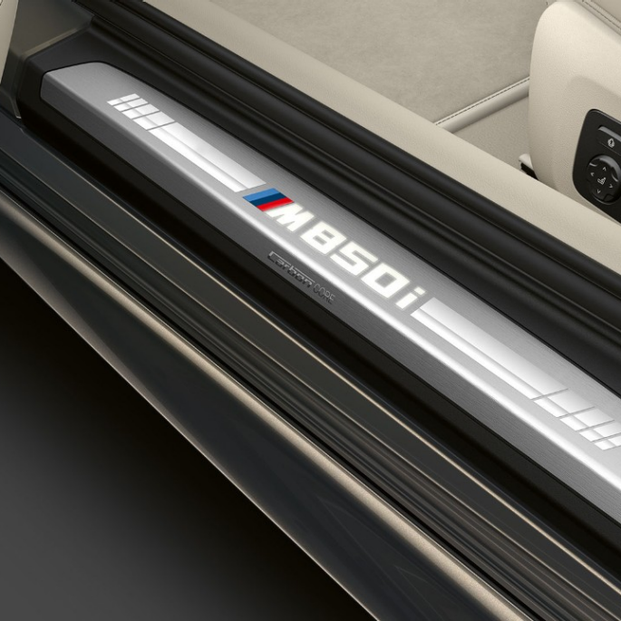 BMW M850i xDrive, Dravit Grey metallic, entry door sill. BMW M850i xDrive, Dravit Grey metallic, entry door sill.